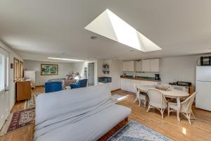 a kitchen and living room with a couch and a table at Walkable, Dog Friendly! Friday Harbor Stay w/ Deck in Friday Harbor