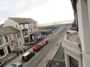 a view of a street with cars parked on the road at No Twelve in Blackpool