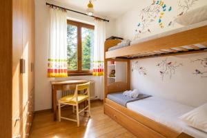 a bedroom with a bunk bed and a desk at Villa Le Rose, Menaggio in Menaggio +28 photos