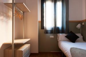 Posteľ alebo postele v izbe v ubytovaní MH Apartments Gracia