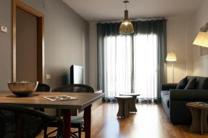 Televízia a/alebo spoločenská miestnosť v ubytovaní MH Apartments Gracia
