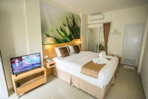 Säng eller sängar i ett rum på Deva Bali Apartement