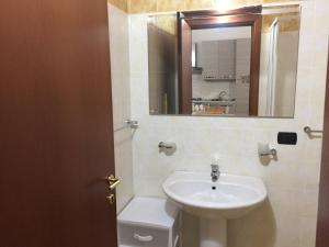 a bathroom with a sink and a mirror at Residence Il Casolare in Piedimonte San Germano +19 photos