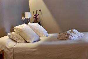 Posteľ alebo postele v izbe v ubytovaní Hotel & Apartaments Thalassa Sport & Spa