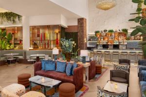 a lobby of a hotel with couches and tables at Hyatt Union Square New York in New York