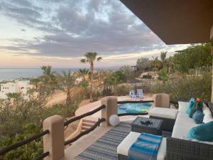 a patio with a couch and a swimming pool at Home With Private Pool Ocean and Mountain Views in Los Barriles