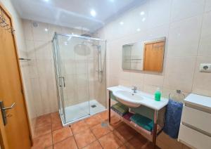 a bathroom with a shower and a sink at Casa do Telhal in Vila Nova de Gaia +30 photos