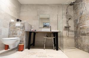 a bathroom with a sink and a toilet and a shower at Aux Buis Gourmands in La Chapelle-en-Vercors +39 photos