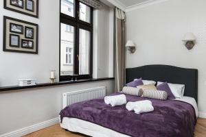 Łóżko lub łóżka w pokoju w obiekcie Bijoux Apartment in Heart of Kazimierz by Otium