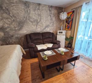 a living room with a couch and a table at Wallace getaway in Delta