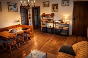 a living room with a table and a dining room at Villa Alina Family Retreat in Pietrasanta
