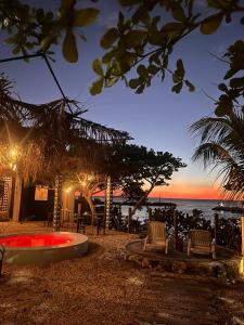 a view of the ocean from a resort at night at Habitación frente al mar y alberca in Lerma +8 photos