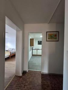 an empty room with a bedroom and a bed at Traumhaus in Küssaberg