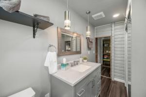 a bathroom with a sink and a mirror at Mat-Su Resort in Wasilla +47 photos