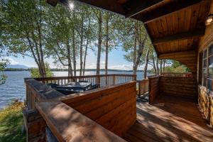 a large deck with a view of the water at Mat-Su Resort in Wasilla