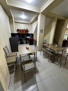 a room with tables and chairs in a building at California Bambú in Iquitos