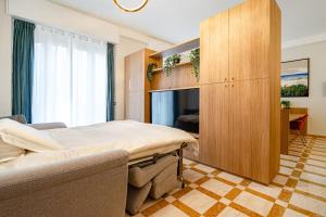 a hospital room with a bed and a cabinet at DibraLuxurySuites Duomo in Milan