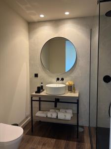 a bathroom with a sink and a mirror at Quinta Vale de Lobos in Folgosa +107 photos