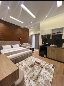 a hotel room with a bed and a living room at Regal View Residences & Suites in Cairo