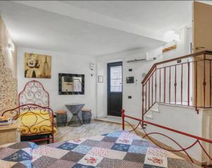 a bedroom with a bed and a stair case at Suite delle Nereidi in Manarola