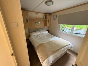 a small room with a bed and a window at Melrose in Lancaster +12 photos