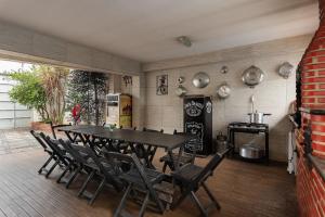 a dining room with a table and chairs at House with Pool in BH for Groups and Families in Belo Horizonte