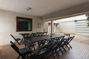a dining room with a table and chairs at House with Pool in BH for Groups and Families in Belo Horizonte +62 photos