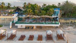 an aerial view of a resort with chairs and umbrellas at Hotel Tropical Inn in Tierra Bomba +48 photos