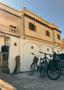 two bikes parked in front of a building at Ira Hostel in Dahab
