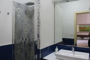 a bathroom with a sink and a shower with a mirror at BrezzaMarina in Sapri +37 photos