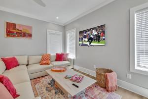 a living room with a couch and a table at Resonant - 2 Townhomes - 2 Private Rooftop Decks in Nashville +82 photos