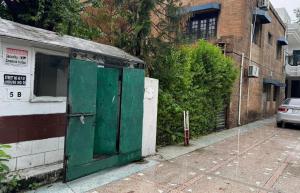 a green door on the side of a building at Arizona 2 in Islamabad