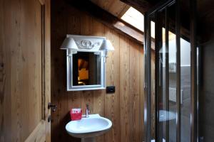 a bathroom with a sink and a mirror at Residenza Loo Bach n 8 in Gressoney-Saint-Jean