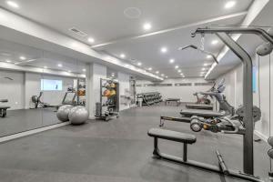 a gym with treadmills and machines in a room at Hyve-Retro Modern-Full Gym-Walk to Broadway in Nashville
