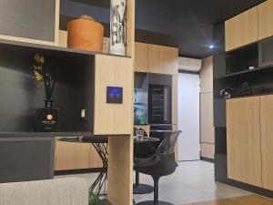 a kitchen with a table and a dining room at 74SUITE Sibenik - Self check in - Garage in Šibenik +10 photos