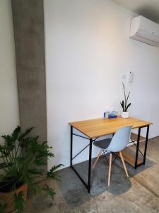 a desk with a chair and a wooden table at Pitaya Guest Suite in El Pescadero +39 photos