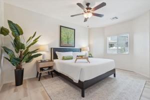 a bedroom with a bed and a ceiling fan at Panorama View - Mountain Views - Community Pool in Fountain Hills