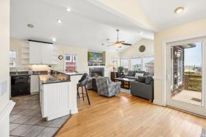 an open kitchen and living room with a counter top at 6107 - No Wake Zone in Nags Head
