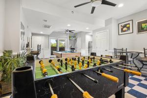 a living room with a foosball table at 6107 - No Wake Zone in Nags Head