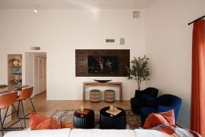 a living room with a couch and chairs and a table at Cactus Spur - Pool & Fire Pit - Mins to Old Town in Scottsdale +62 photos