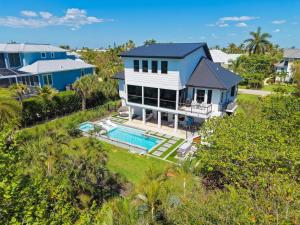 an aerial view of a house with a swimming pool at Pelican's Perch in Sanibel