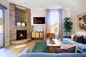 a living room with a couch and a fireplace at Citrus-Pool & Spa-Walk 2 restaurants, shops & bars in Phoenix