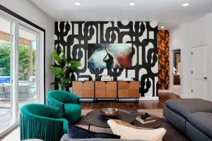 a living room with a couch and a table at Contour - Sparkling Pool - Mins to Phoenician Golf in Phoenix +66 photos