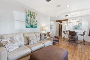 a living room with a couch and a table at Rhone - In Old Town - Walk to Fashion Square in Scottsdale