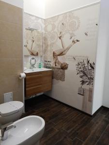 a bathroom with a toilet and a sink at BudapestEasyFlat Basilica Lux in Budapest