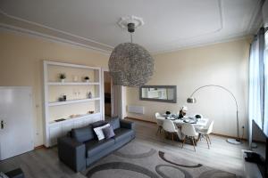 a living room with a couch and a table at BudapestEasyFlat Basilica Lux in Budapest