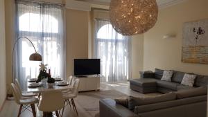 a living room with a couch and a table at BudapestEasyFlat Basilica Lux in Budapest