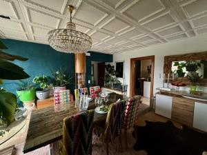 a dining room with a table and chairs at Penthouse in Schaan in Schaan
