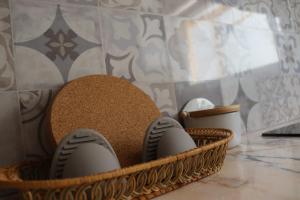 a basket with sandals and a hat on a counter at Lugar de São Braz in Alter do Chão