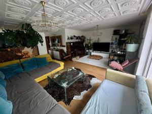 a living room with a couch and a table at Penthouse in Schaan in Schaan